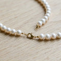 Model wearing Aurora Xiaomi Pearl Necklace